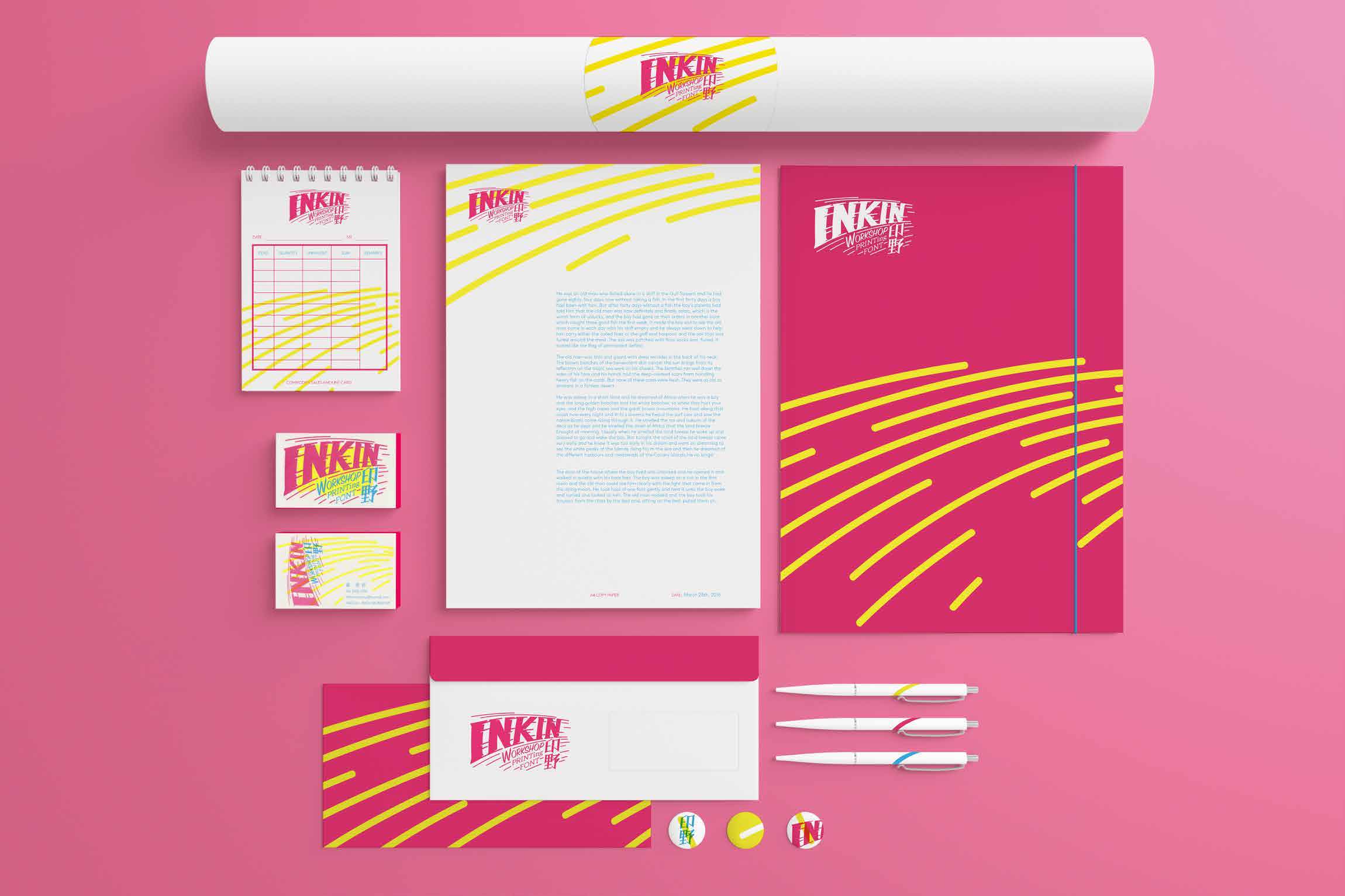 INKIN identity system arranged across stationery and studio objects