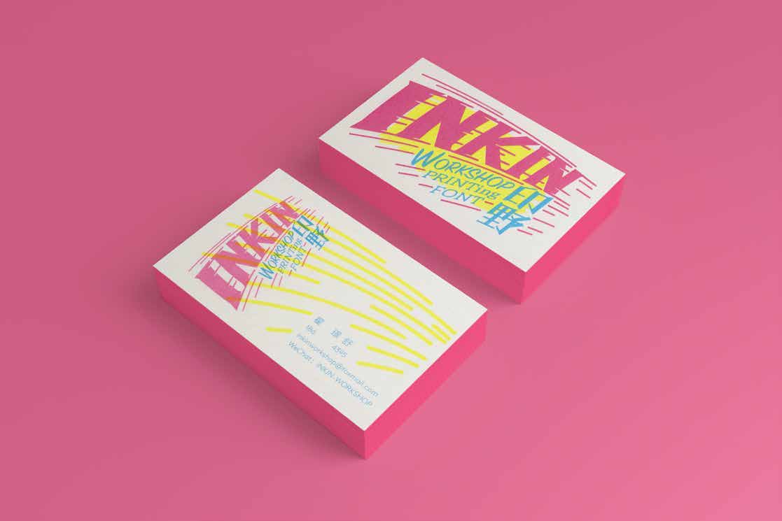 Front and back INKIN business cards in magenta yellow and cyan